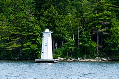 Herrick Cove Light by Evergreen Trees of Lake Sunapee